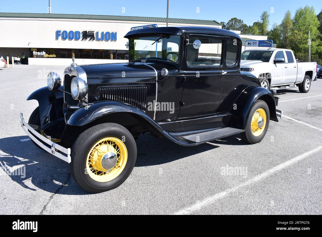 An Antique Ford Model A on display at a car show. Stock Photo
