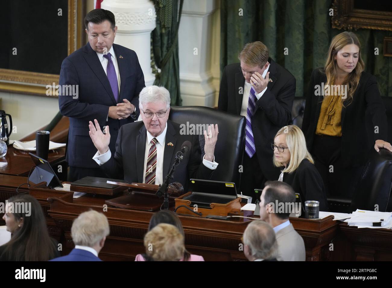 Austin Texas USA, September 14, 2023: Lt. Gov. DAN PATRICK (center), acting as trial judge, talks with defense and prosecuting attorneys during the morning session on day eight in Texas Attorney General Ken Paxton's impeachment trial in the Texas Senate. Credit: Bob Daemmrich/Alamy Live News Stock Photo