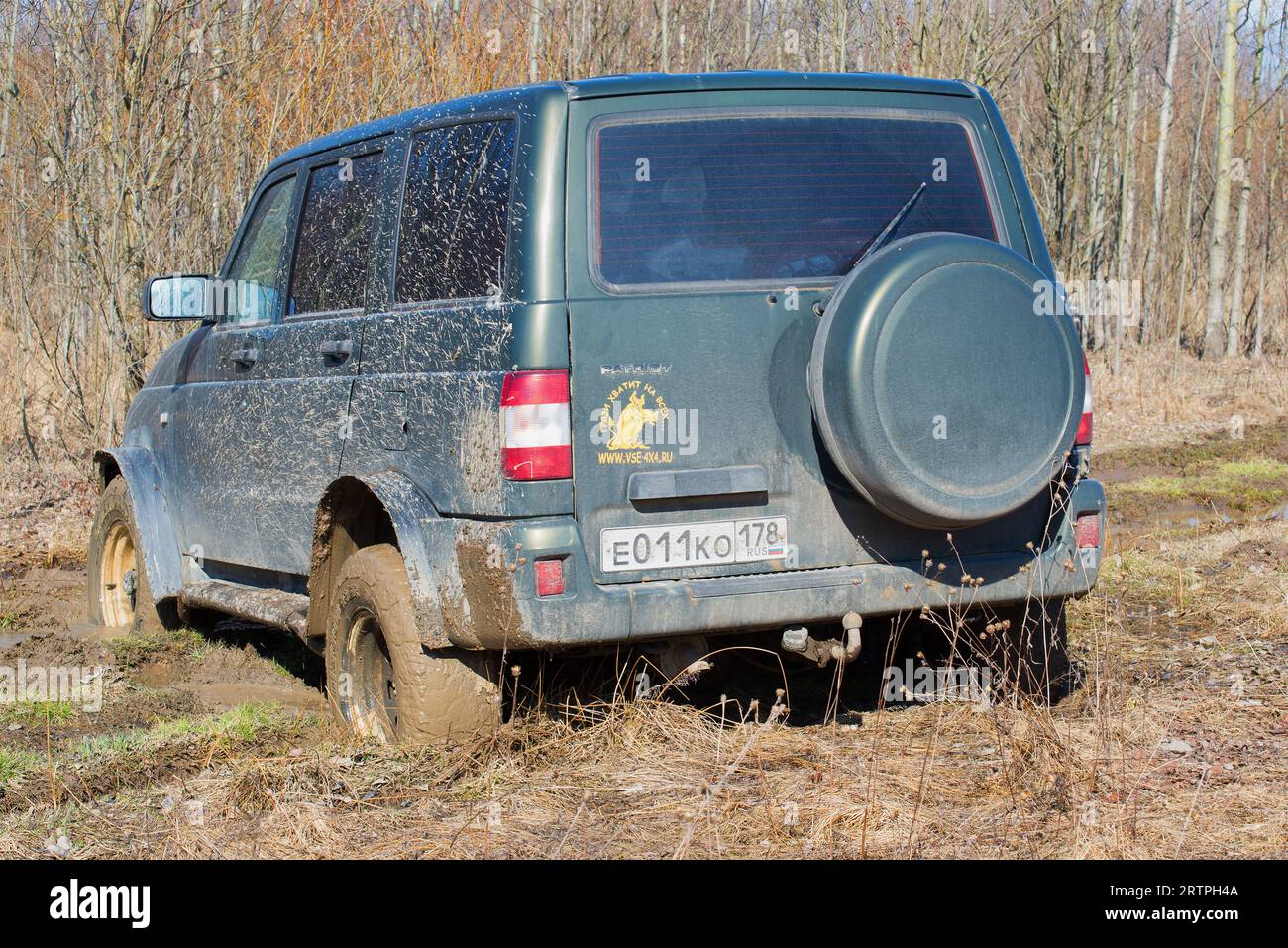 LENINGRAD REGION, RUSSIA - APRIL 16, 2016: UAZ-Patriot off-road stuck in the spring forest Stock Photo