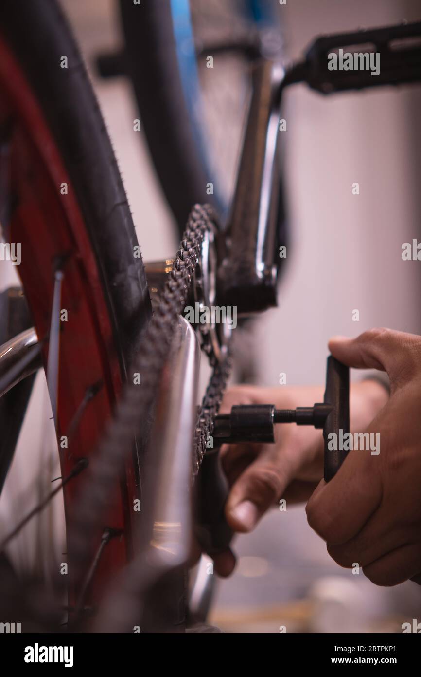 unrecognizable tightening the chain of a bmx Stock Photo - Alamy