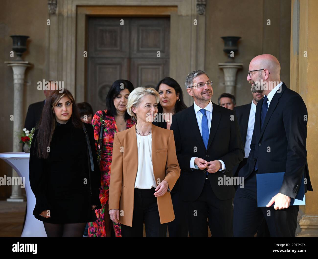 14 September 2023, Brandenburg, Potsdam: Shima Babaei (l-r), Iranian women's rights activist, Ursula von der Leyen, President of the European Commission, and Mike Schubert (SPD), Mayor of the City of Potsdam, are welcomed to the M100 Medie Award ceremony by Moritz van Dülmen (r), Managing Director of Kulturprojekte Berlin GmbH, at the Orangiere Sanssouci. In the second row walk Jasmin Tabatabai (l-r), German-Iranian actress and musician, Mersedeh Shahinkar (hidden), Iranian activist, and Düzen Tekkal, human rights activist. The M100 Media Award has been presented since 2005 as part of the inte Stock Photo