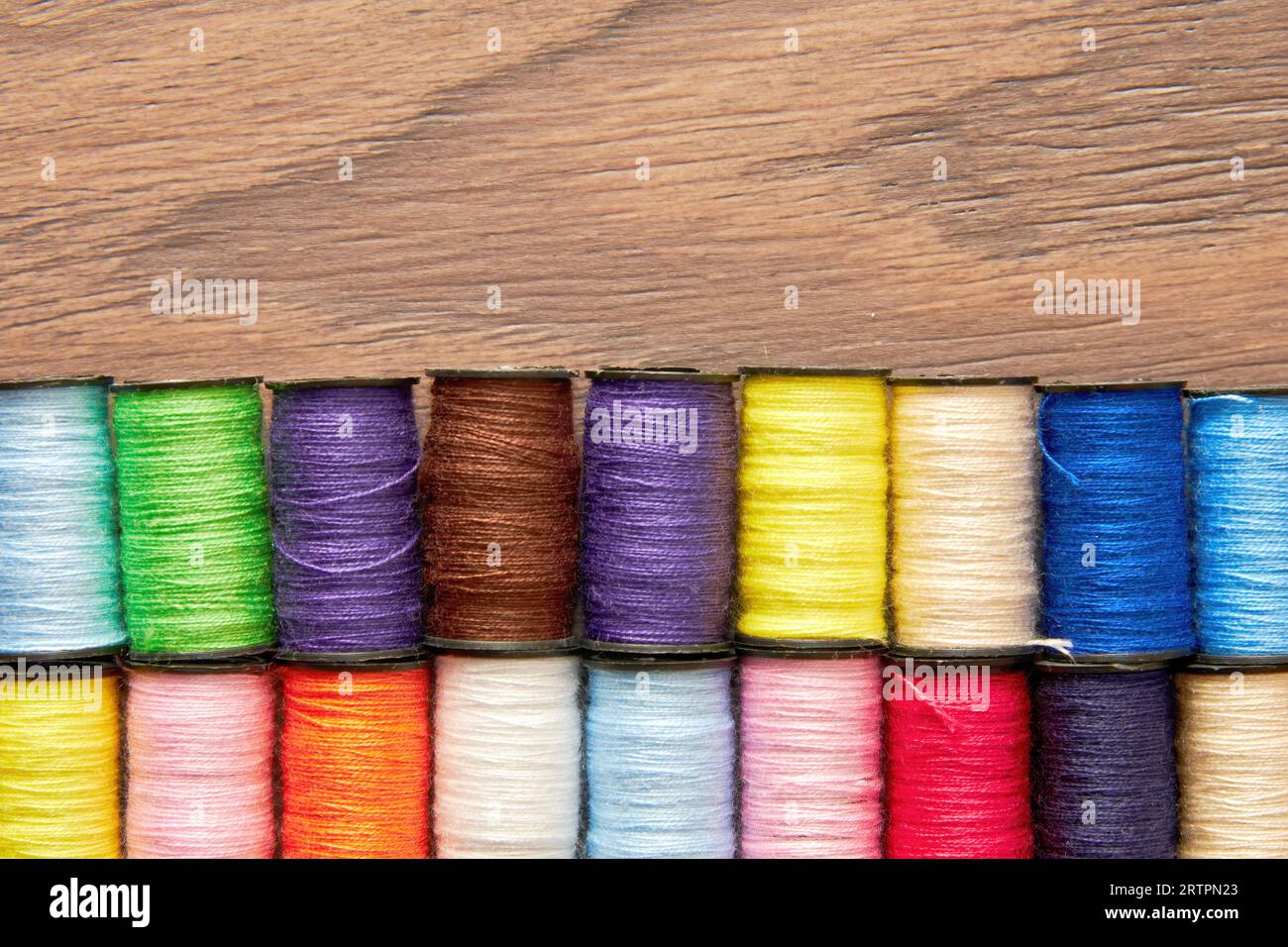 Embroidery template with colorful thread spools in a row. Sewing ...