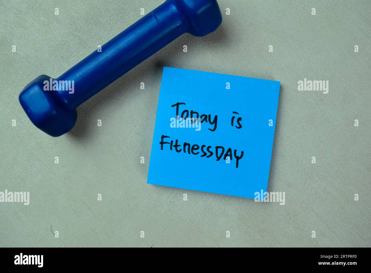 Concept of Today is Fitnessday write on sticky notes isolated on Wooden Table. Stock Photo
