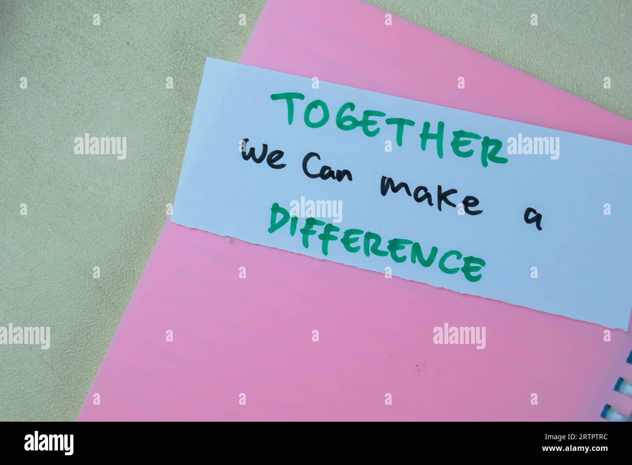 Concept of Together we can make a Difference write on sticky notes isolated on Wooden Table. Stock Photo