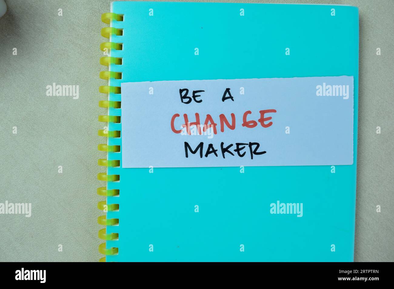 Concept of Be a Change Maker write on sticky notes isolated on Wooden Table. Stock Photo