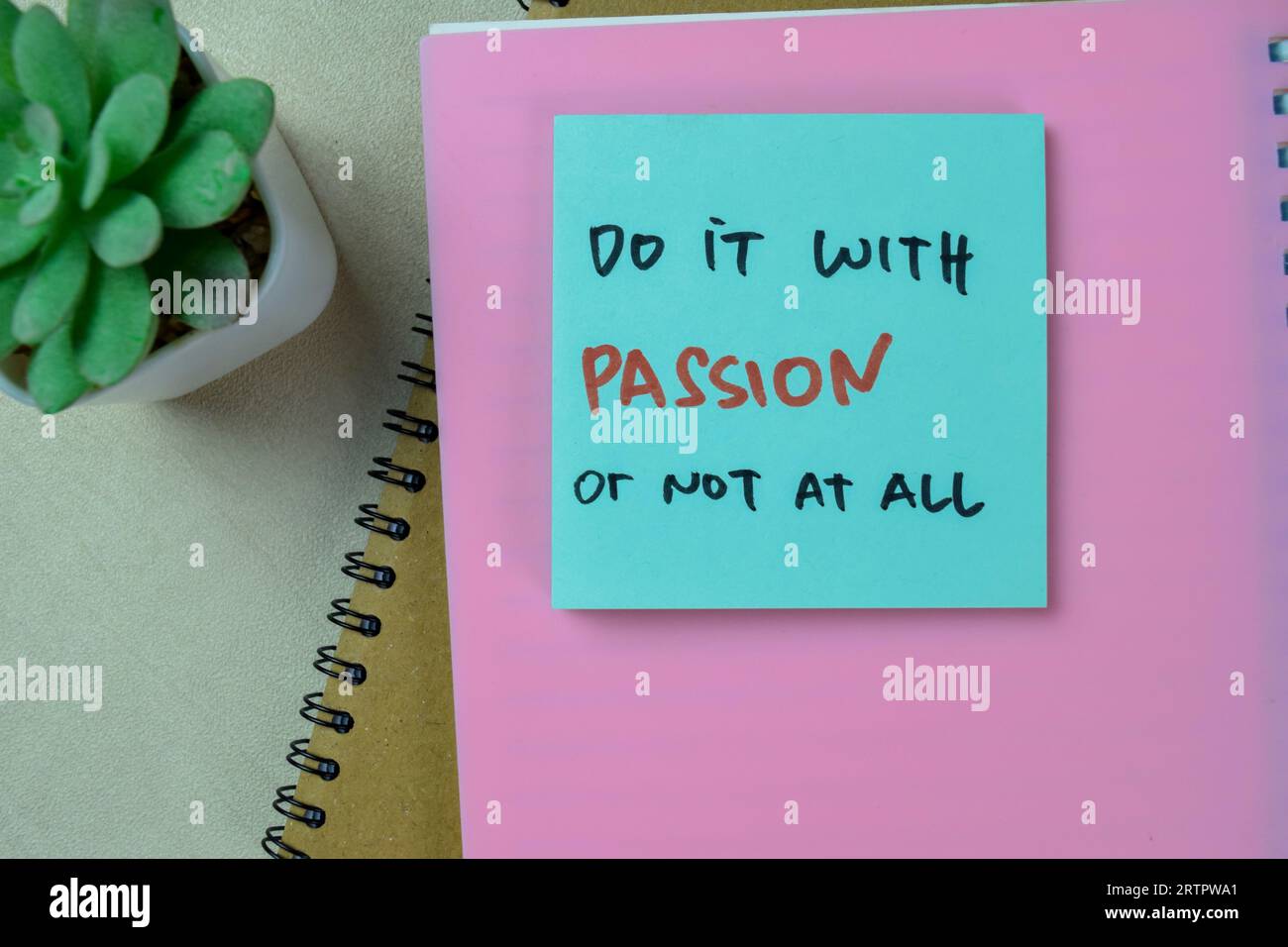 Concept of Do It With Passion or Not At All write on sticky notes isolated on Wooden Table. Stock Photo