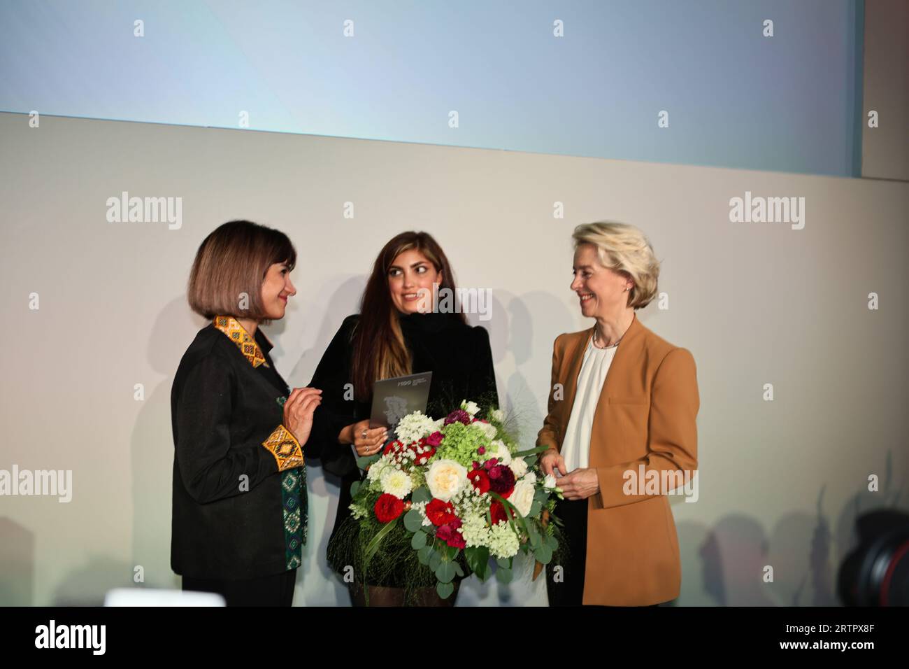 Potsdam, Germany, September 14, 2023, (l-r)  Mersedeh Shahinkar, Shima Babaei, Ursula von der Leyen on stage from the M100 Media Award to the Iranian “Women, Life, Freedom” movement in the Orangerie in Park Sanssouci. Sven Struck/Alamy Live News Stock Photo