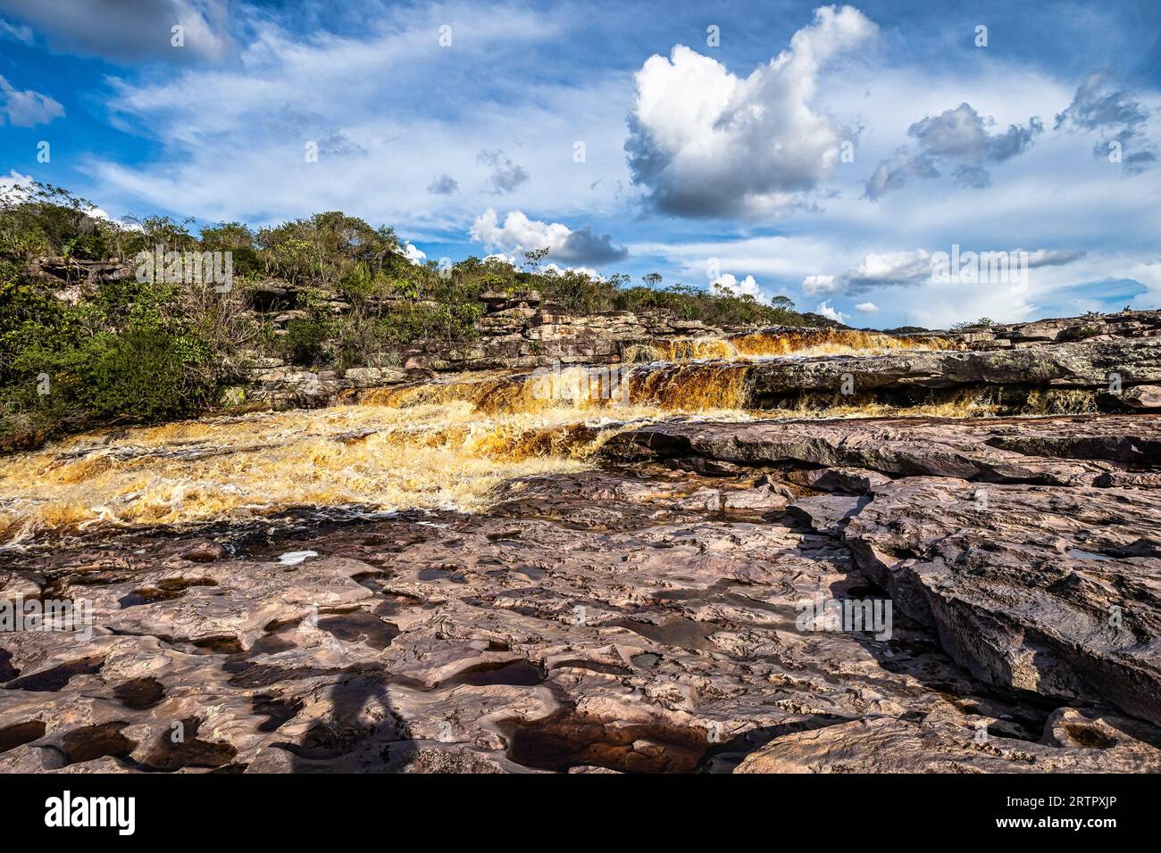 The Tiburtino waterfall in Mucuge, in the Chapada Diamantina, in Bahia, Brazil running over rocks and stones. Sempre Viva park Stock Photo