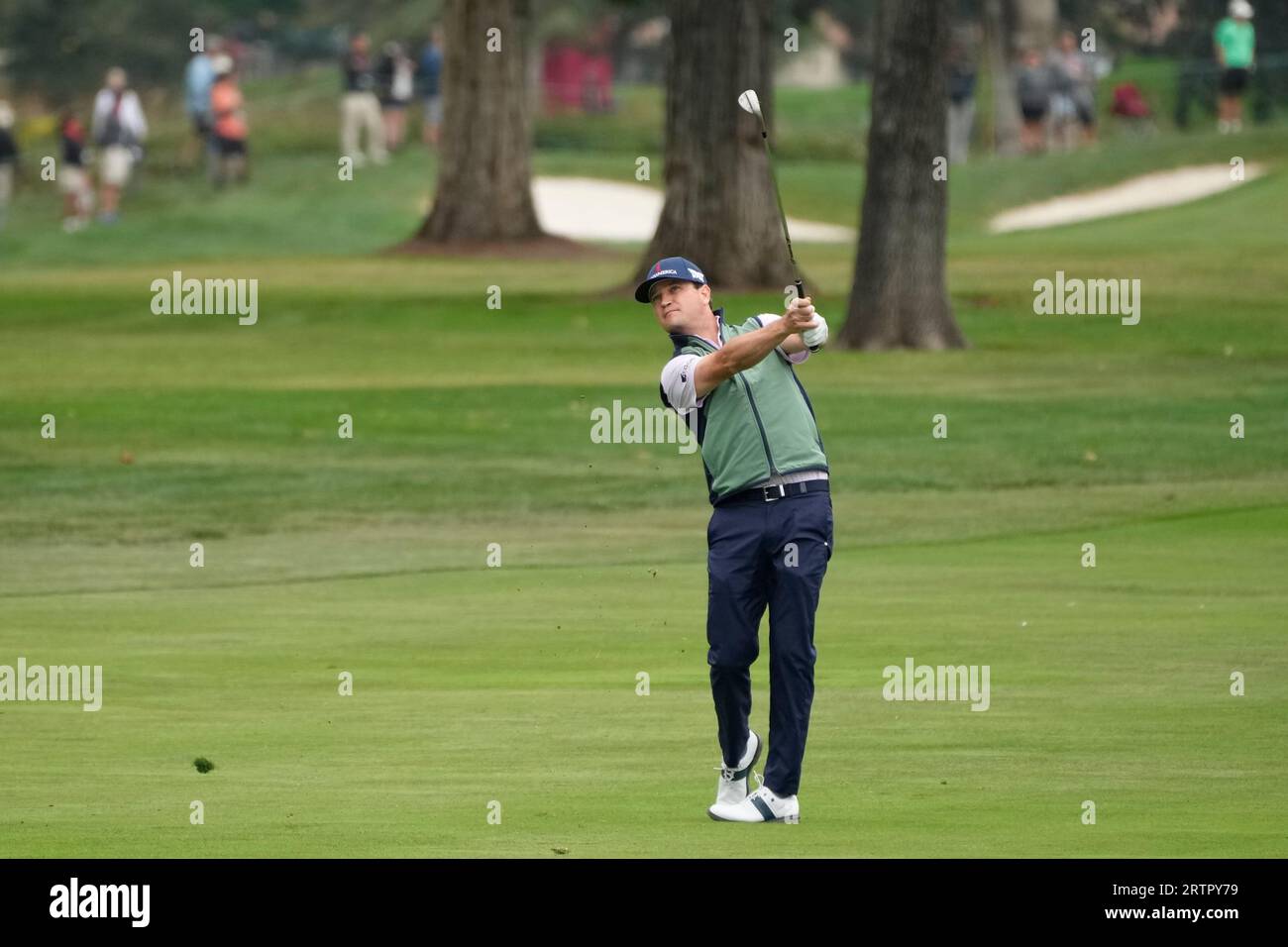 Zach Johnson follows his approach shot to the 18th green of the