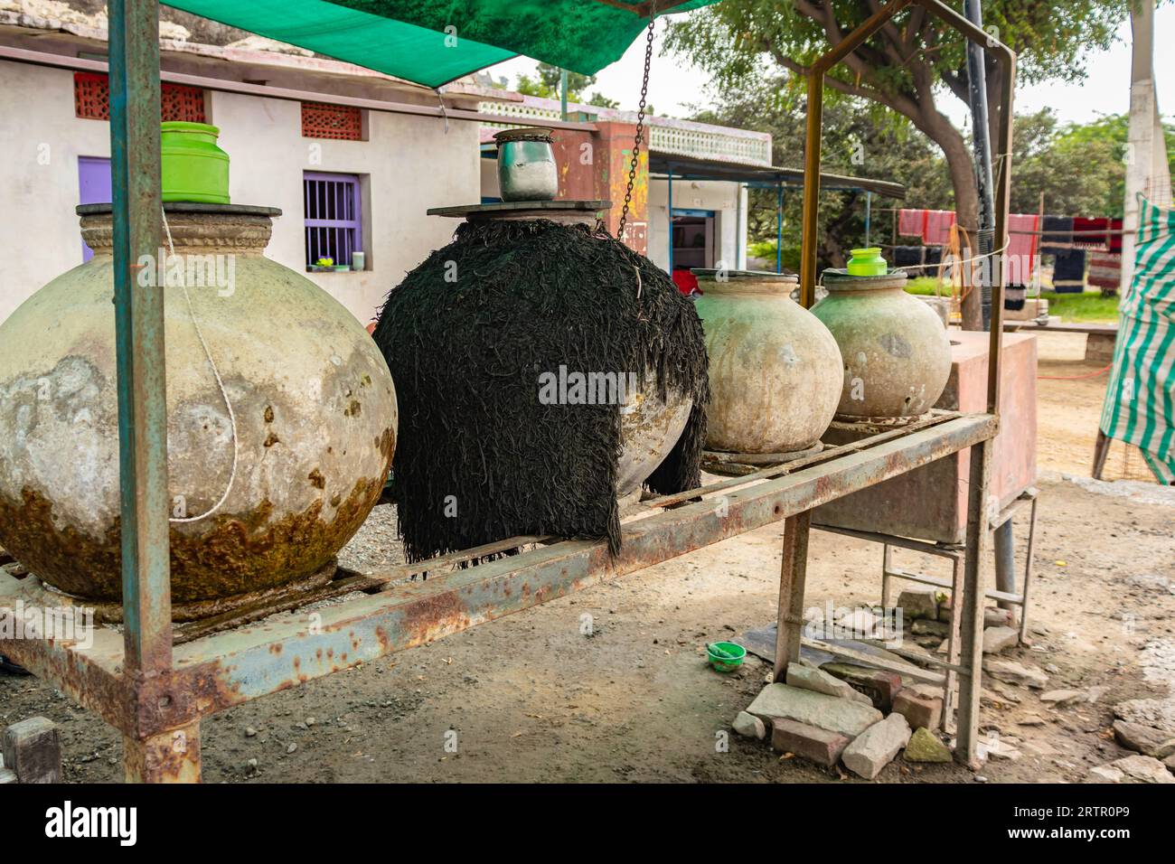 big clay jars are placed on road sides for storage of drinking water for traveler at day Stock Photo