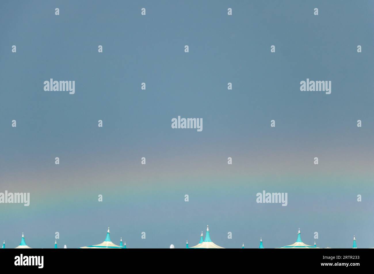 Rainbow in the blue sky and white clouds. Abstract background Stock ...