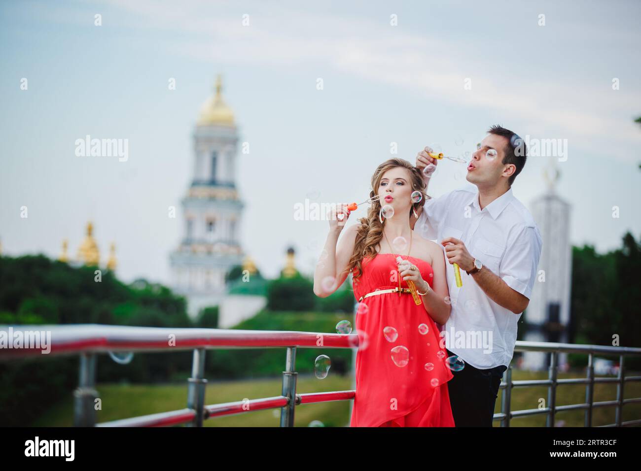 Cheerful young couple having fun and laughing together outdoors Stock ...