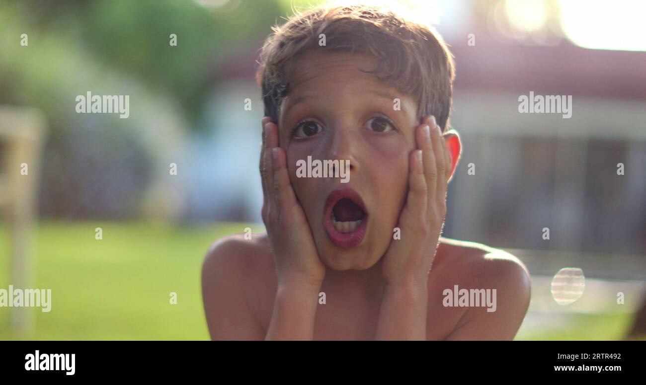 Child boy SHOCK reaction with despair. Emotional kid reacting with confusion Stock Photo