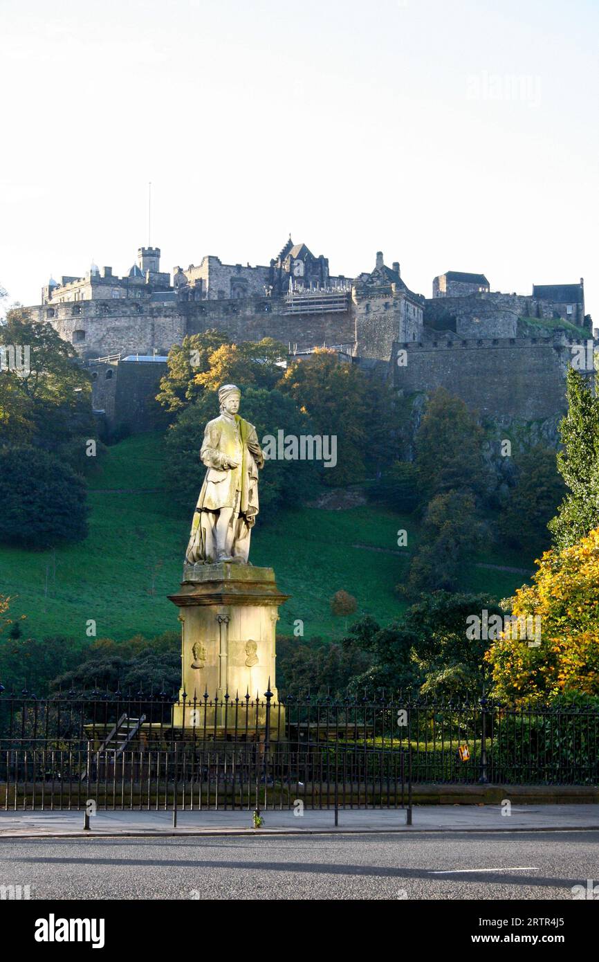 Statue of Allan Ramsay with the Edinburgh Castle on the top of the hill ...