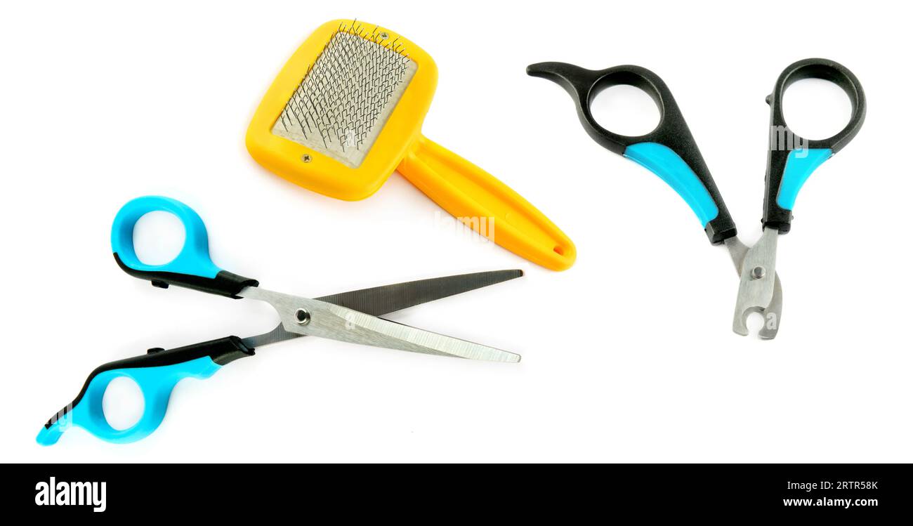 Scissors, slicker and nail clipper isolated on a white background. Wide