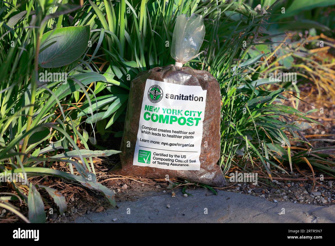 A bag of NYC Sanitation branded New York City Compost. Stock Photo