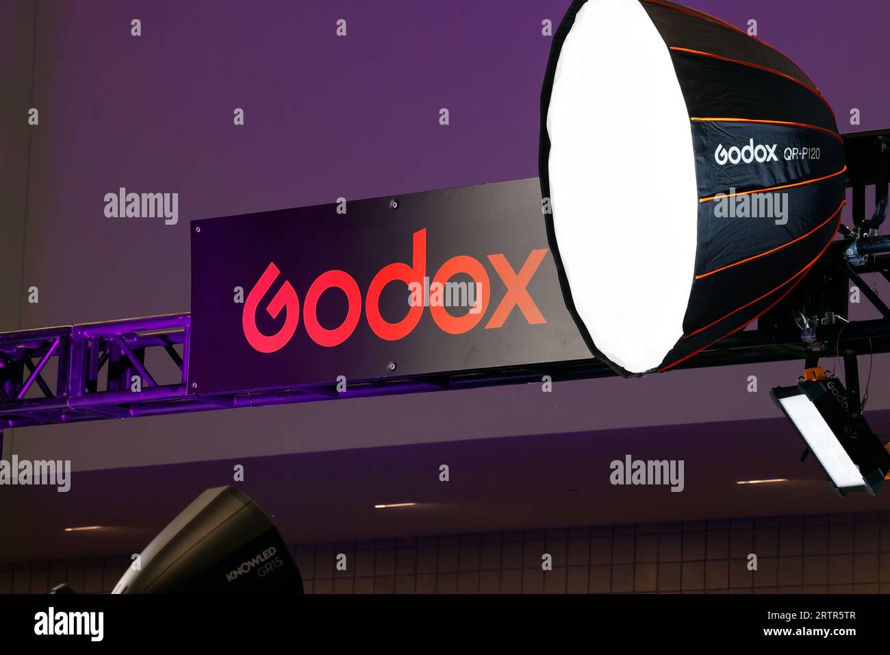 Signage for Godox photographic studio lighting equipment at a trade show exhibition. Stock Photo