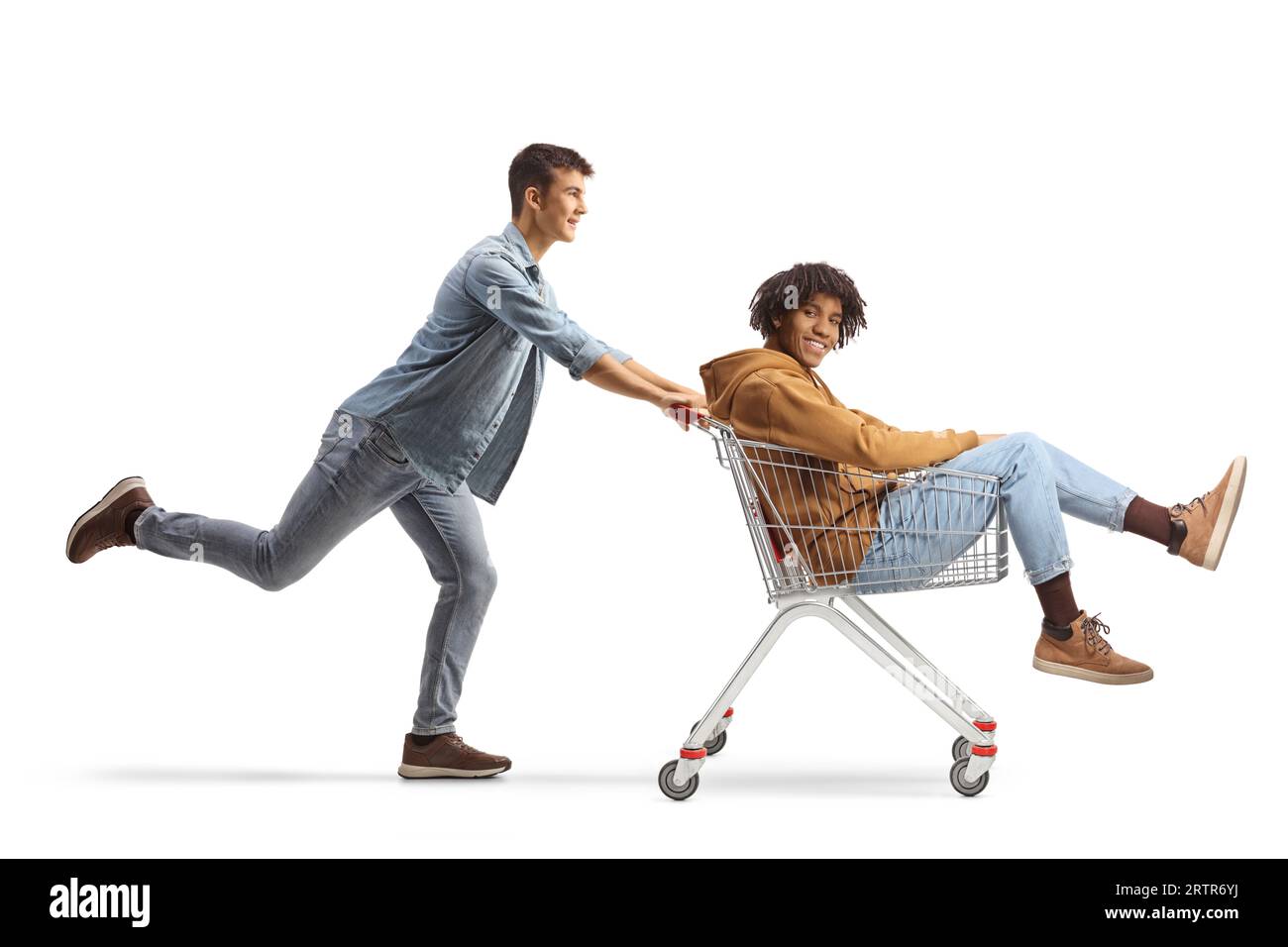 Friends riding with a shopping cart isolated on white background Stock