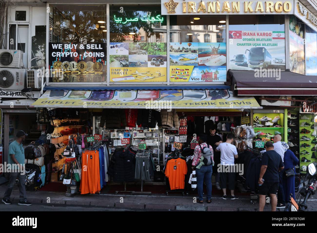 A clothes shop on Divan Yolu Cd. offering to buy Crypto coins, in Istanbul, Turkey Stock Photo