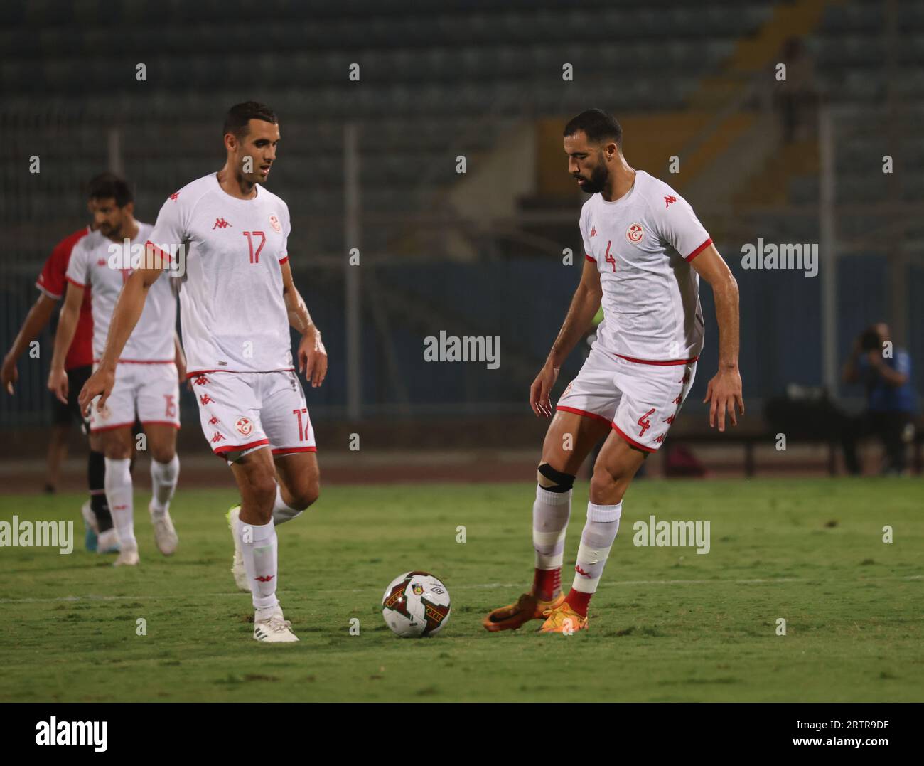 Egypt, Cairo - 12 September 2023 - Yassine Meriah, Ellyes Skhiri during friendly international match between Egypt and Tunisia at 30th June Stadium in Stock Photo