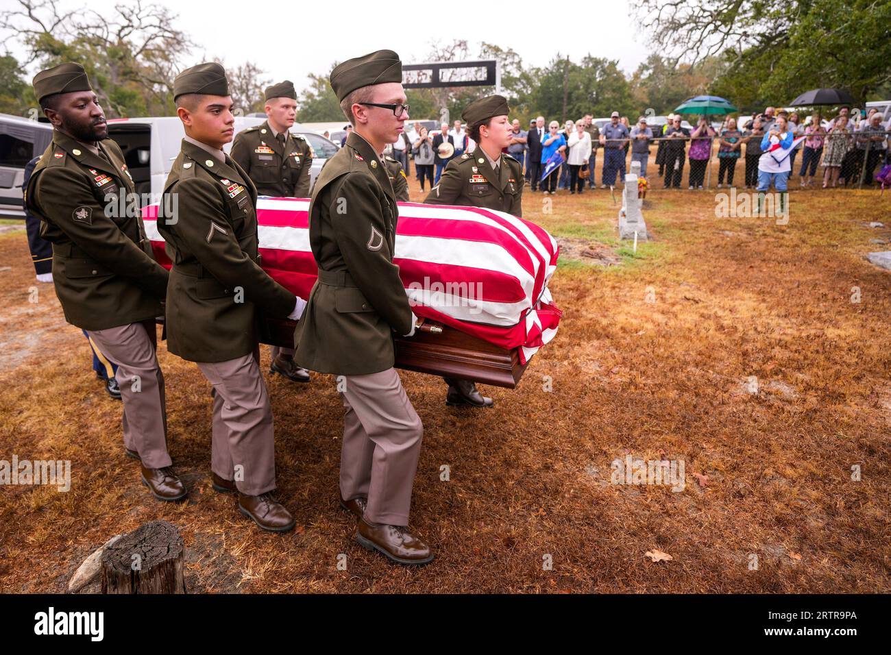 A U.S. Army honor guard carry the remains of Army Air Corps Tech Sgt