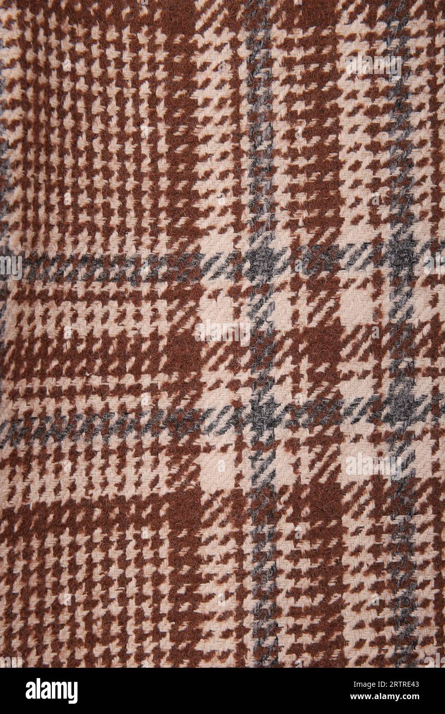 Classic tweed, Wool Background Texture. Coat close-up. Expensive suit fabric. Glenurquhart check is made of woolen fabric with a woven twill design of Stock Photo