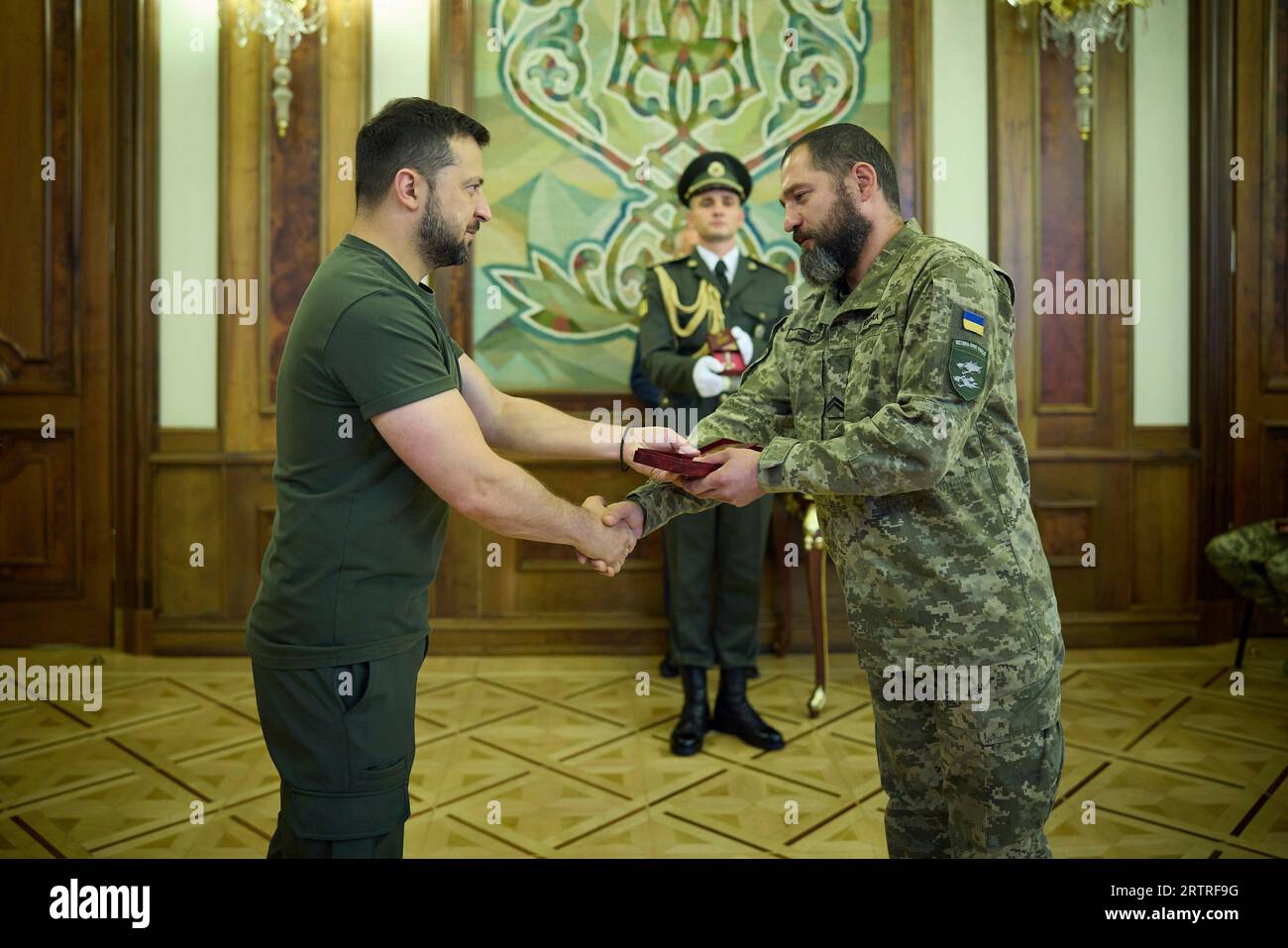 Kyiv, Ukraine. 14th Sep, 2023. Ukrainian President Volodymyr Zelenskyy, left, presents military medals to soldiers with the tank divisions to mark Day of Tank Forces, at the Mariinskyi Palace, September 14, 2023 in Kyiv, Ukraine. Credit: Ukraine Presidency/Ukrainian Presidential Press Office/Alamy Live News Stock Photo