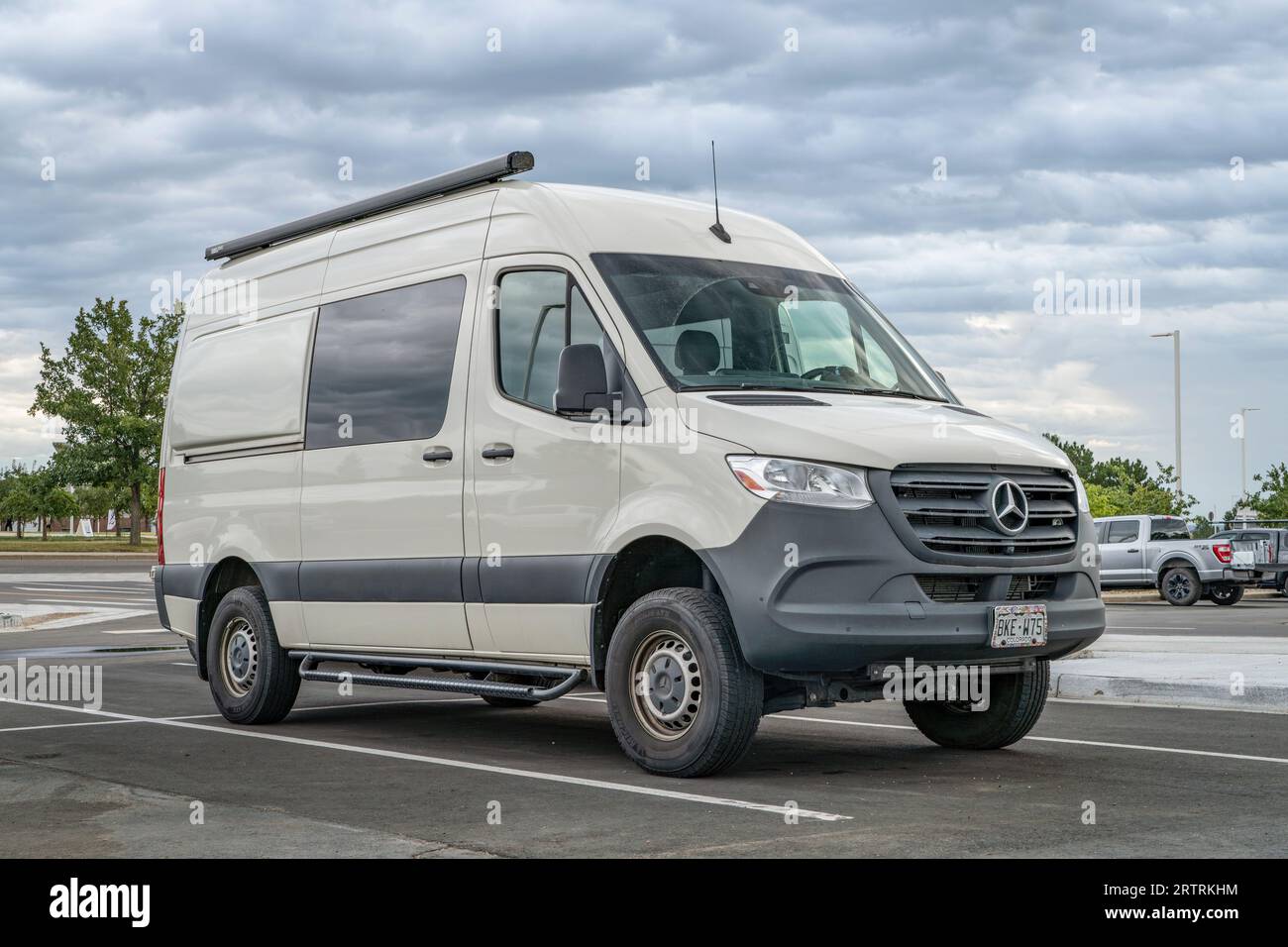 Loveland, CO, USA - August 25, 2023: 4x4 camper van on Mercedes Sprinter chassis at a parking lot. Stock Photo