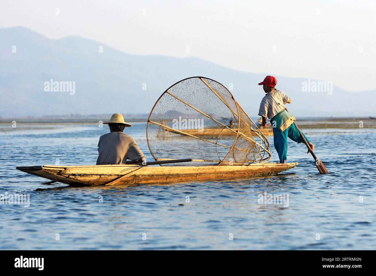 Leg rower on Inle Lake, fishing in a small boat, Myanmar Stock Photo ...