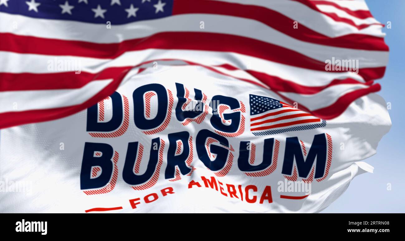 Arthut, US, June 2023: Flags of Doug Burgum election campaign and the national flag of the United States waving. 2024 US presidential elections. Illus Stock Photo