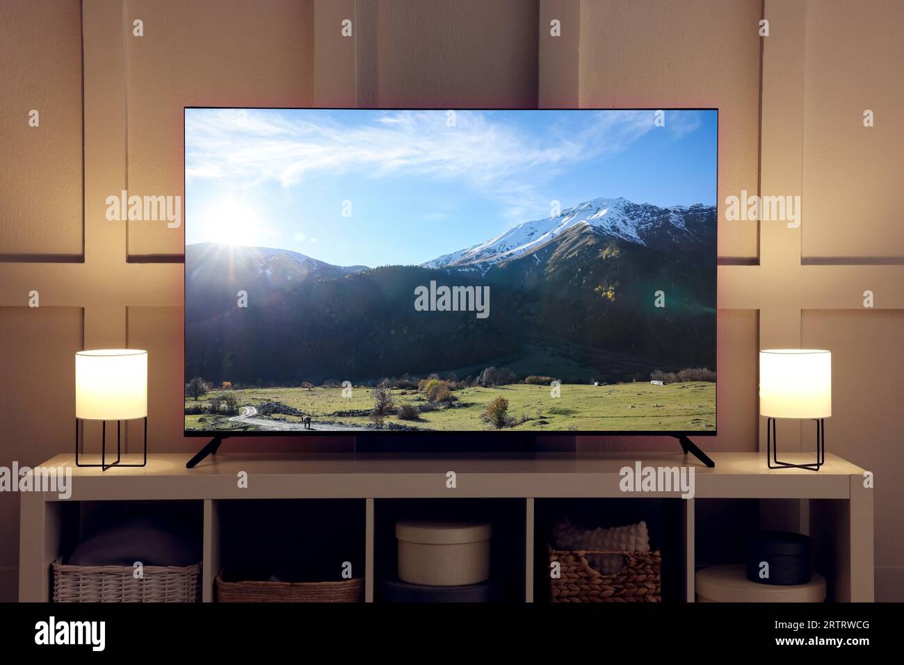 Amazing mountain landscape on TV screen in room Stock Photo