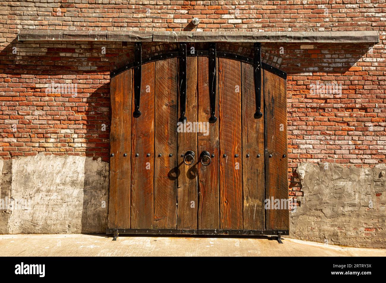 WA23626-00...WASHINGTON - Solid doors on an empty building on the shores of Port Townsend Bay in the town of Port Townsend. Stock Photo