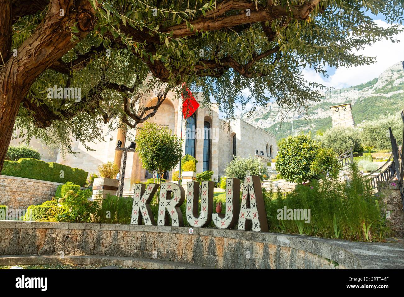 Kruja lettering on Kruje Castle and its fortress with walls. Albania ...