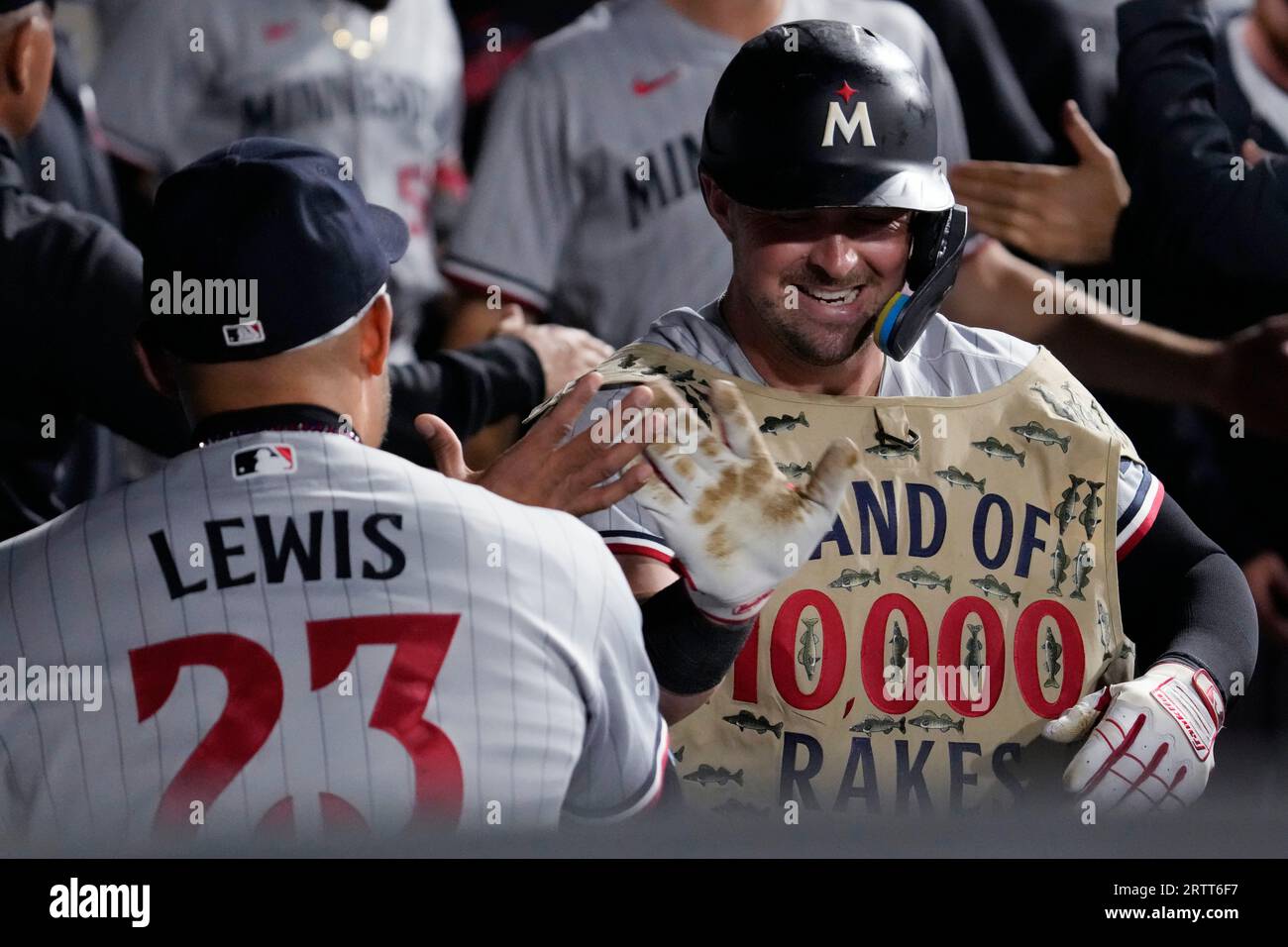 Minnesota Twins' Kyle Farmer, right, celebrates with Royce Lewis after  hitting a two-run home run against the Chicago White Sox during the seventh  inning of a baseball game in Chicago, Thursday, Sept.