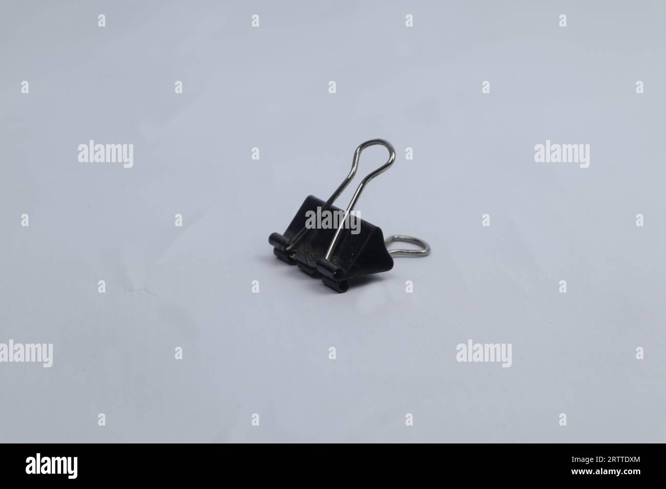black paper clip isolated on white background Stock Photo Alamy