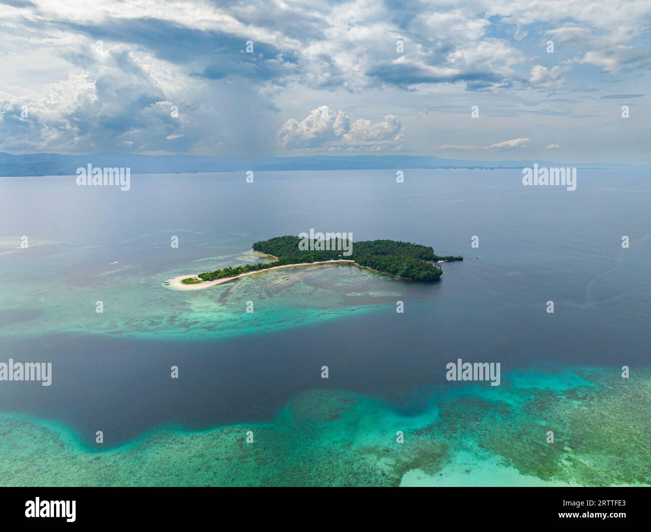 Cabgan Islet with white sandy beach, blue sky and clouds. Barobo, Surigao del Sur. Philippines. Stock Photo