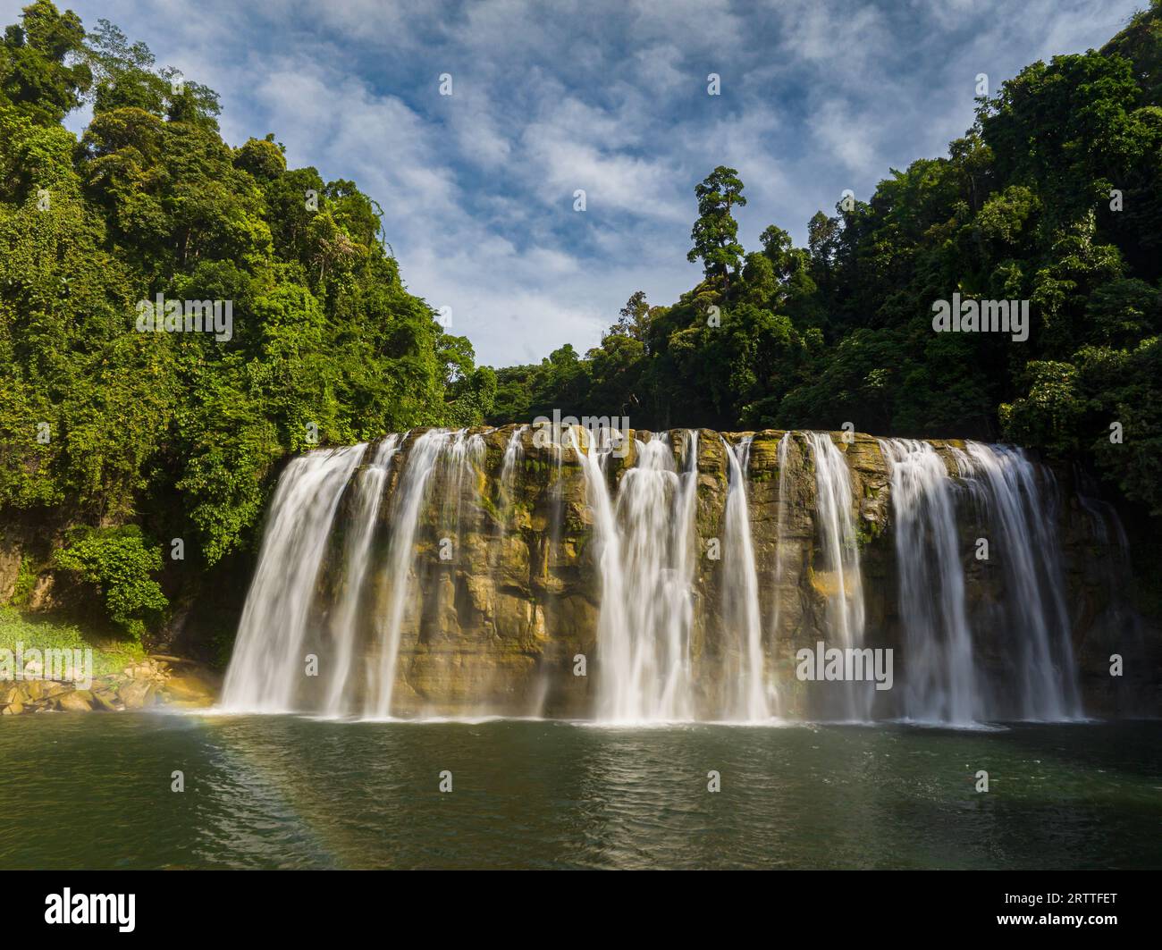 Sunlight over the Tinuy-an Falls in Bislig, Surigao del Sur. Philippines. Stock Photo