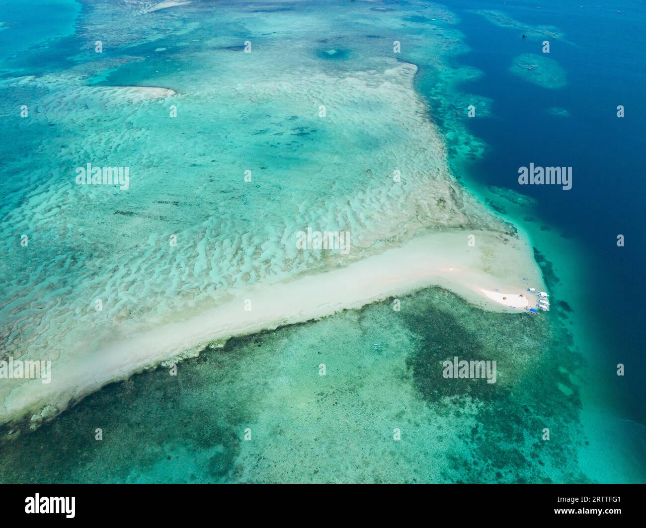 Vanishing Island and turquoise water with coral reefs. Barobo, Surigao del Sur. Philippines. Stock Photo