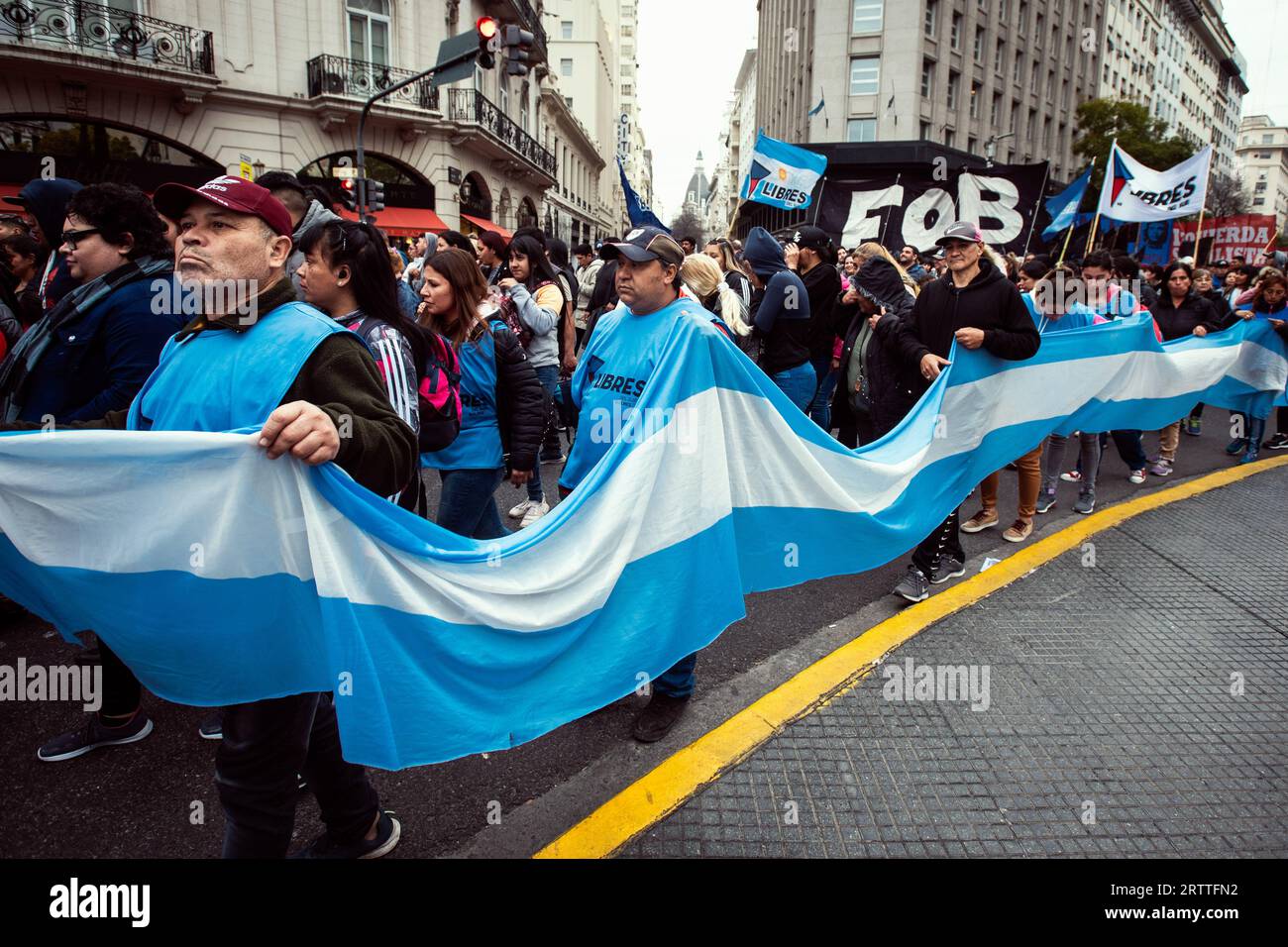 Buenos Aires, Argentina. 14th Sep, 2023. Protesters hold an Argentine flag during the demonstration of social organizations. Social organizations held a protest against the economy minister Sergio Massa who Is also one of the presidential candidates. Also against Javier Milei, presidential candidate of La Libertad Avanza coalition (right Wing). In the contest of and economic crisis in Argentina. Credit: SOPA Images Limited/Alamy Live News Stock Photo