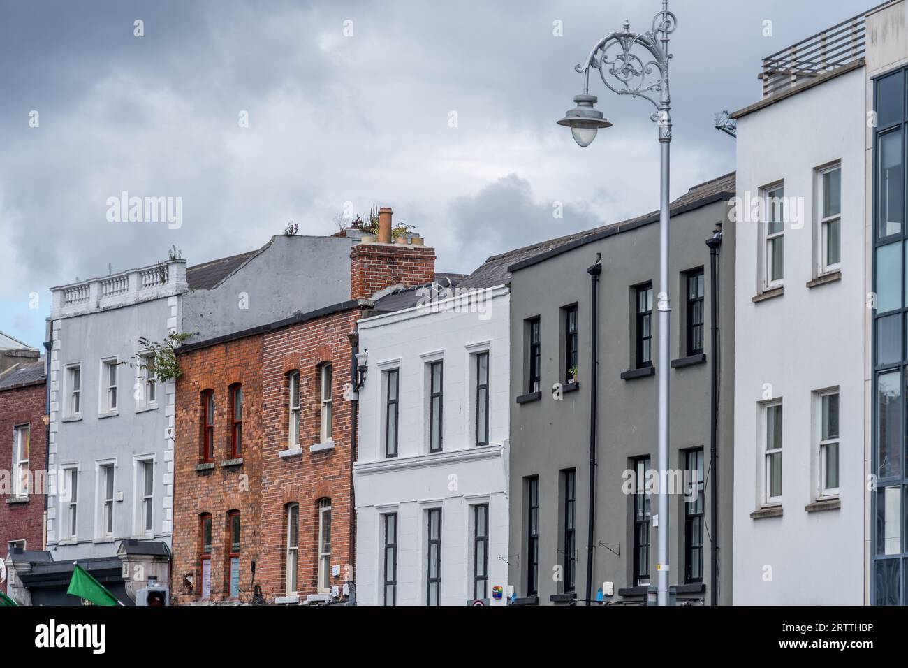 Typical Dublin city houses with brick facade and silver lamp post Stock Photo