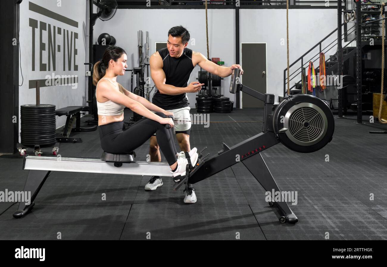 Active couple engaging in a dynamic workout session at the gym Stock ...