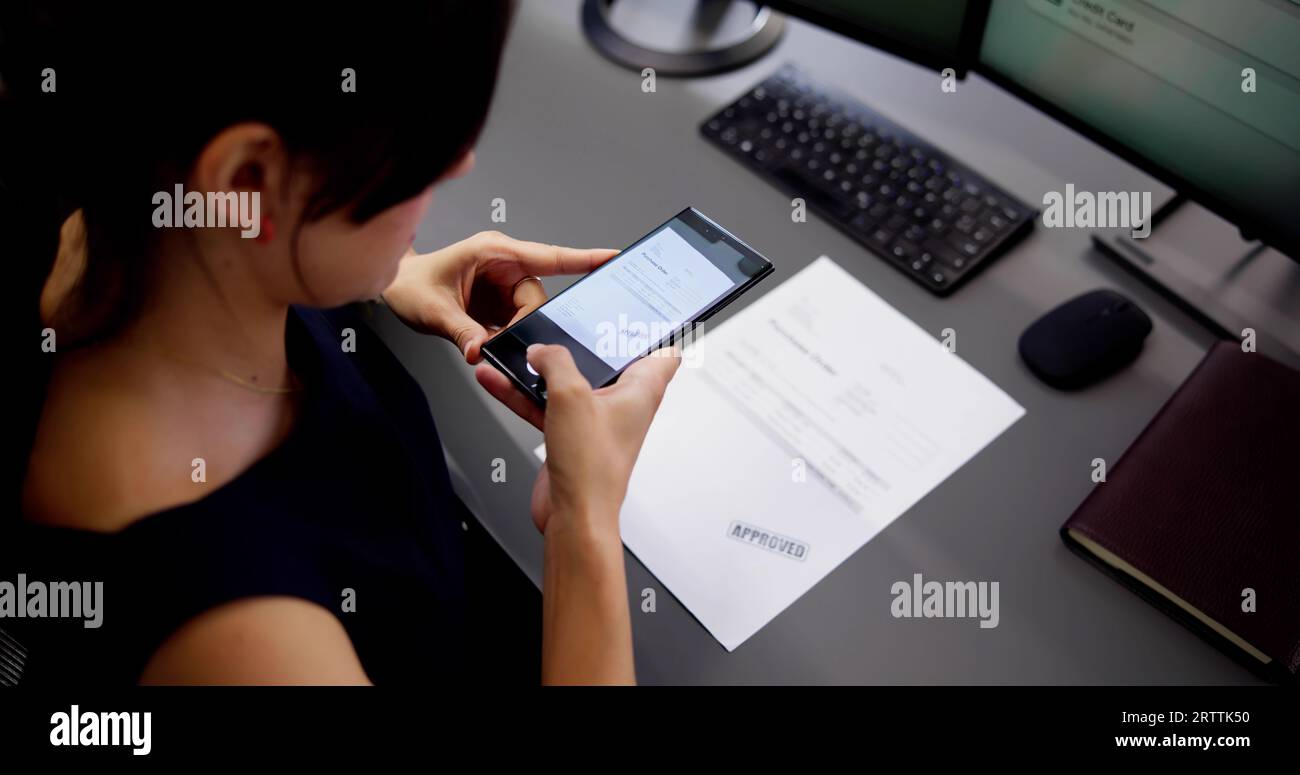 Taking Document Picture Or Photo With Phone. Smartphone Optical Document Stock Photo