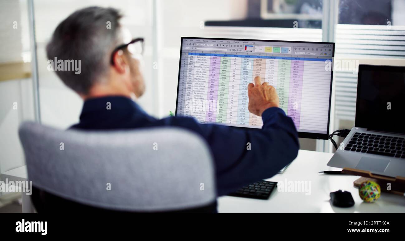 Business Data Audit Spreadsheet On Analyst Computer Stock Photo