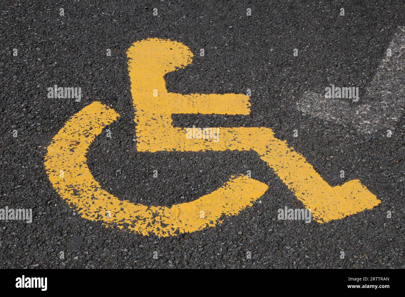 Disabled parking sign painted on tarmac Stock Photo - Alamy