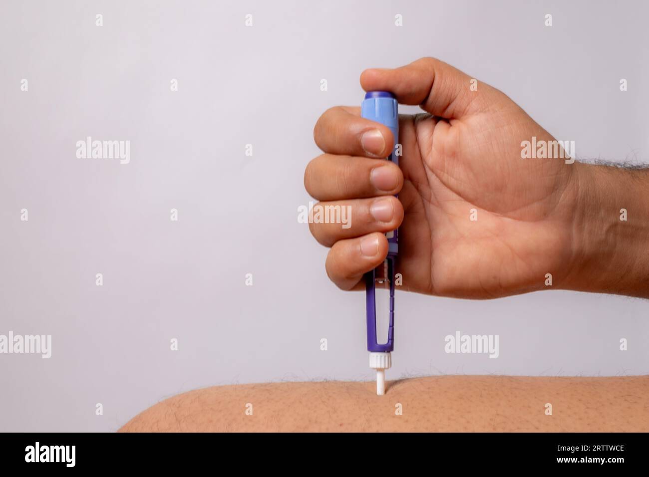 photo of diabetic pen injection on skin Stock Photo