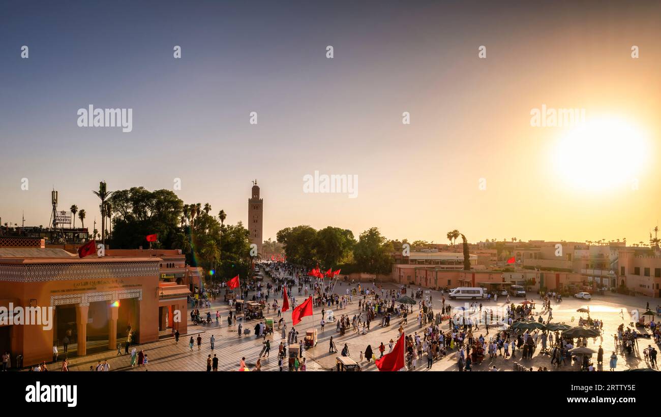 Sunset aerial view of Jemaa el-Fnaa square  with the Kutubiyya or Koutoubia mosque in background. Marrakech Medina. Marrakesh, Morocco. Stock Photo