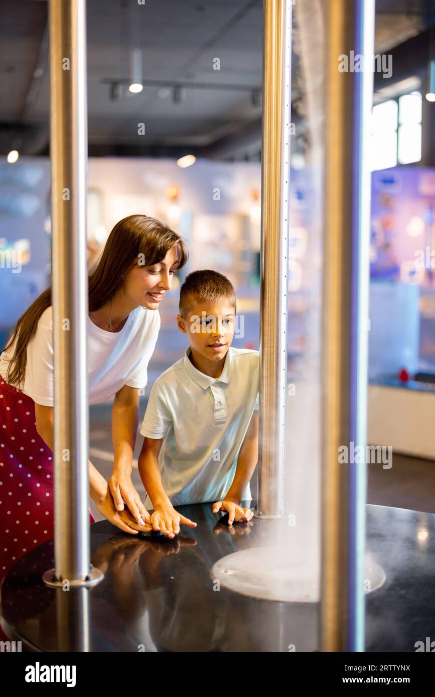 Mom with boy visit a science museum Stock Photo