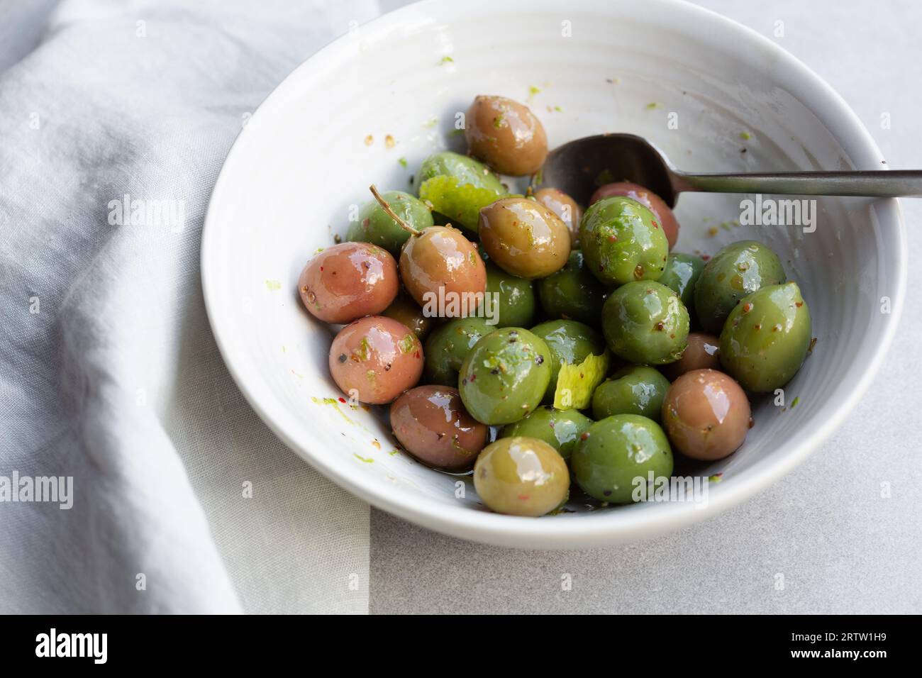 Marinated sicilian olives in a bowl Stock Photo