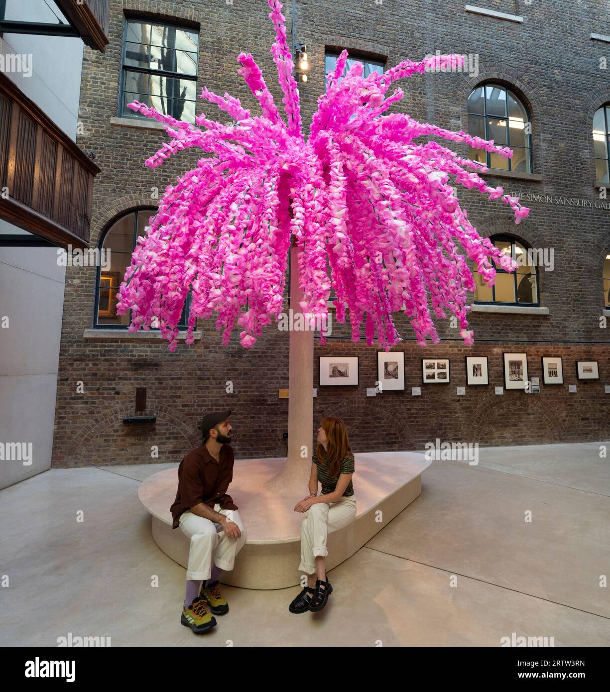 V&A, London, UK. 15th Sep, 2023. For London Design Festival 2023 the V&A have commissioned 5 installations by international contemporary designers which celebrate the global power of design to bind communities. Image: “Hana Mikoshi” A 5-Metre-tall seating installation, covered with 50,000 cherry blossom flowers made of Japanese Washi paper. The Washi Paper was handcrafted by craftspeople in Japan and applied to the structure by V&A visitors throughout summer. The installation is inspired by the Mino Matsuri festival in Japan. Credit: Malcolm Park/Alamy Live News Stock Photo