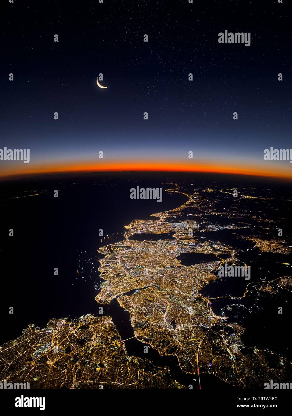 View of Istanbul, Bosphorus, Marmara sea and moon landscape from the airplane at night Stock Photo